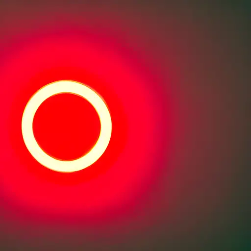 A red alarm light on a device with bright white ring around it